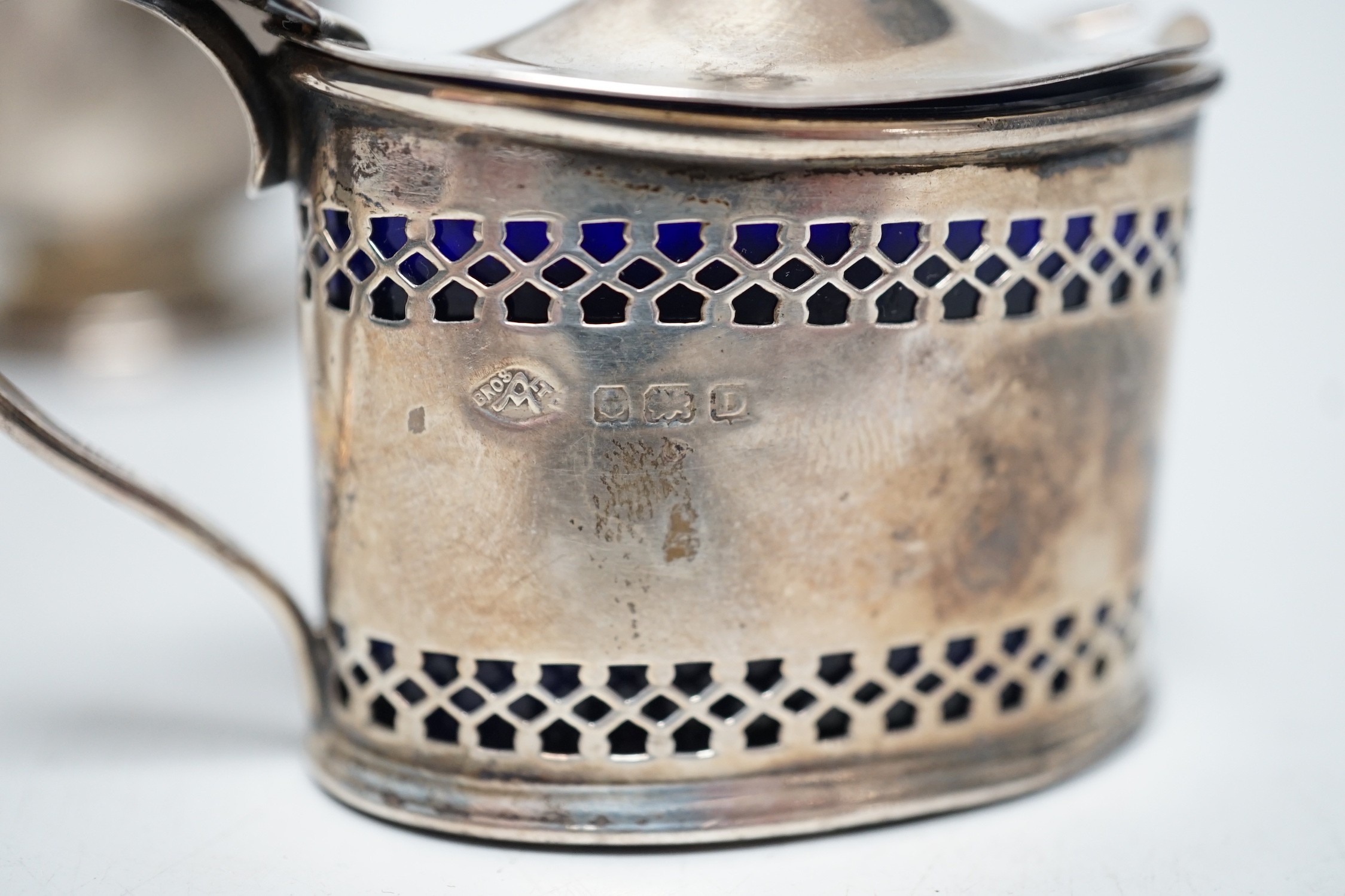 Small silverware, including a George V cream jug and matching sugar bowl, a mustard pot and matching pepper pot, silver serviette ring and a gentleman’s silver pocket watch and chain.